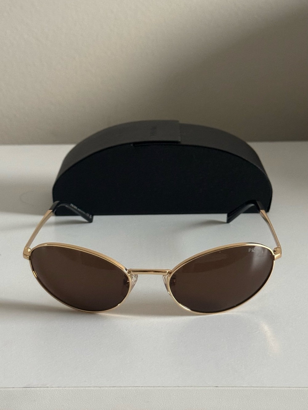 PRADA PRA59S Women's Gold
Oval Sunglasses